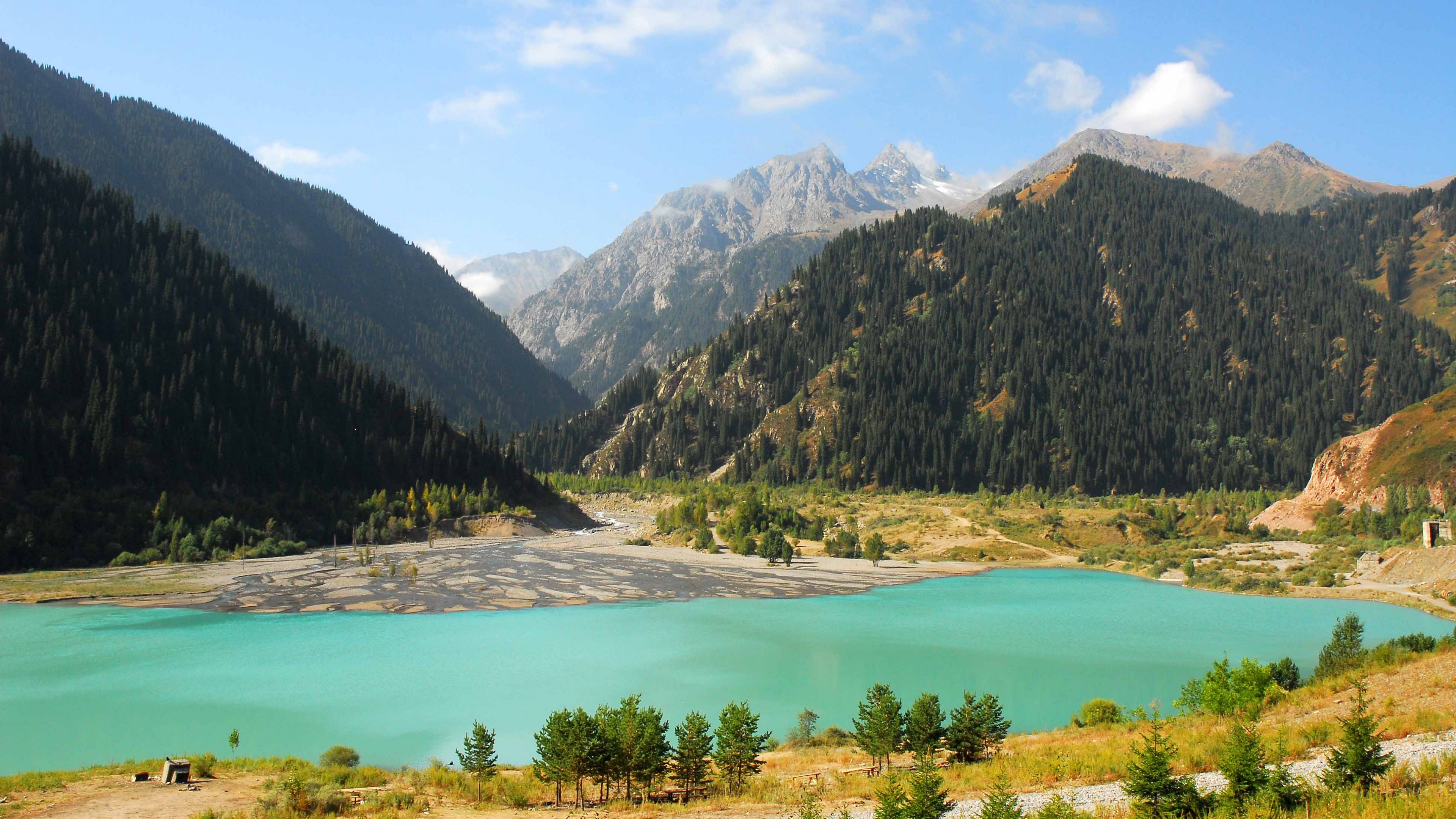 lake-issyk-kul-3840x2160-kyrgyzstan-mountains-forest-4k-16352.jpg